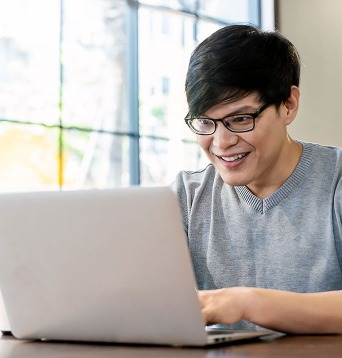 Man on laptop voting